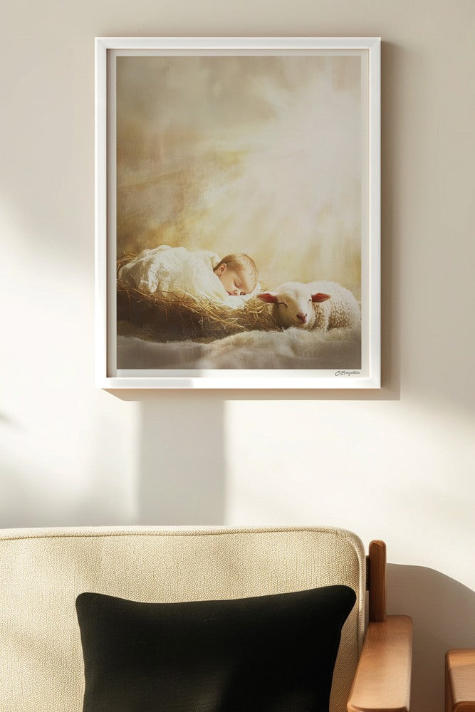 Behold the Lamb Christian art, white frame on wall above chair