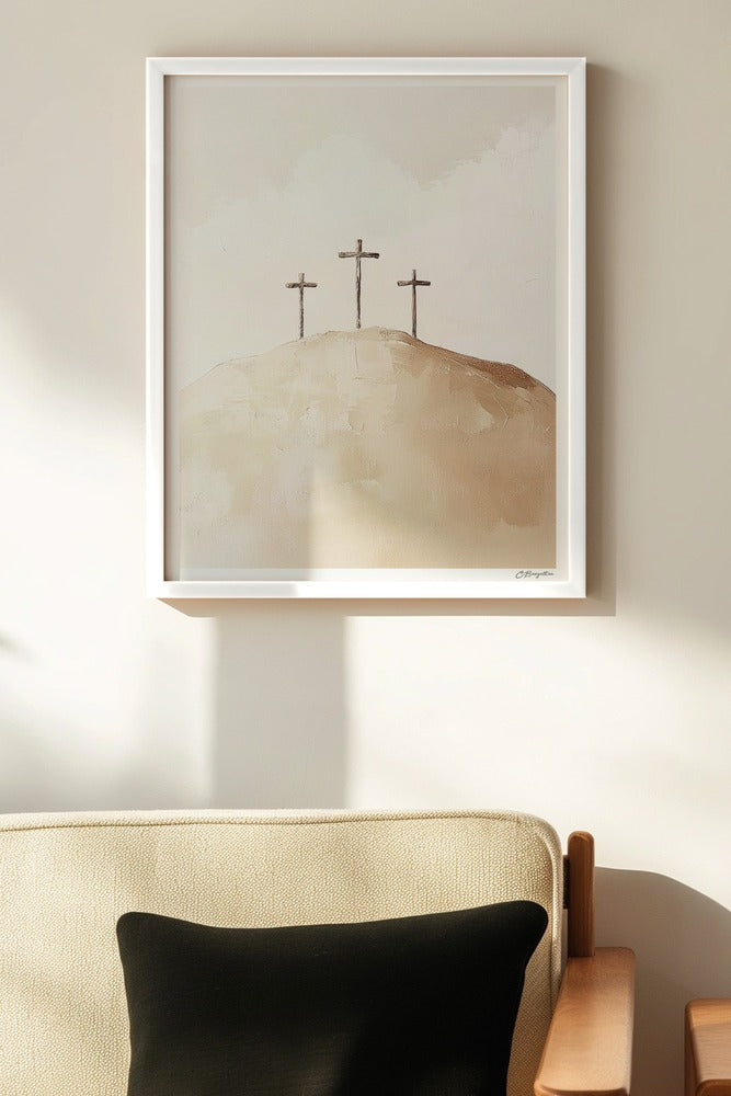 Calvary Christian art, white frame on wall above chair