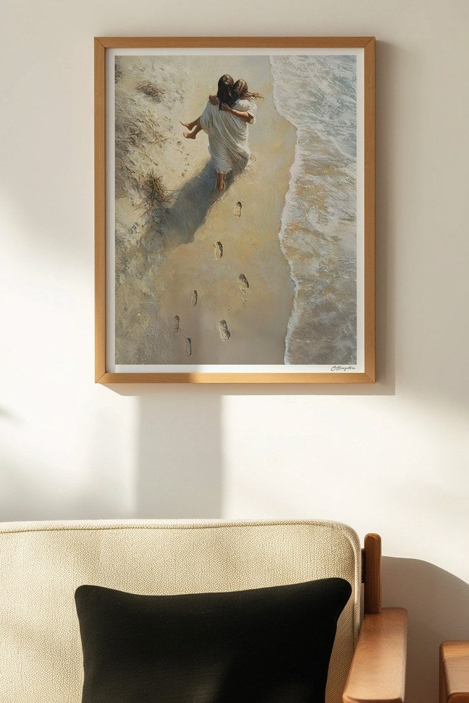 He Carried Me art in an oak frame hanging above a chair