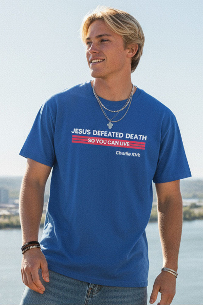 Man wearing the royal blue Jesus Defeated Death tee
