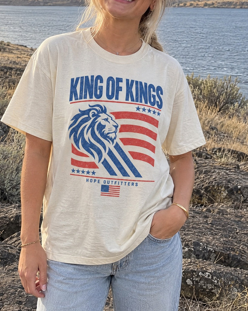 King of Kings Lion Tee - close-up of the ivory tee's King of Kings lion print worn by a blonde woman by the Columbia River