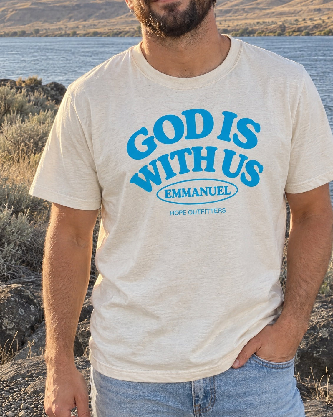 Emmanuel God With Us Tee - close-up of the God Is With Us print worn by a bearded man