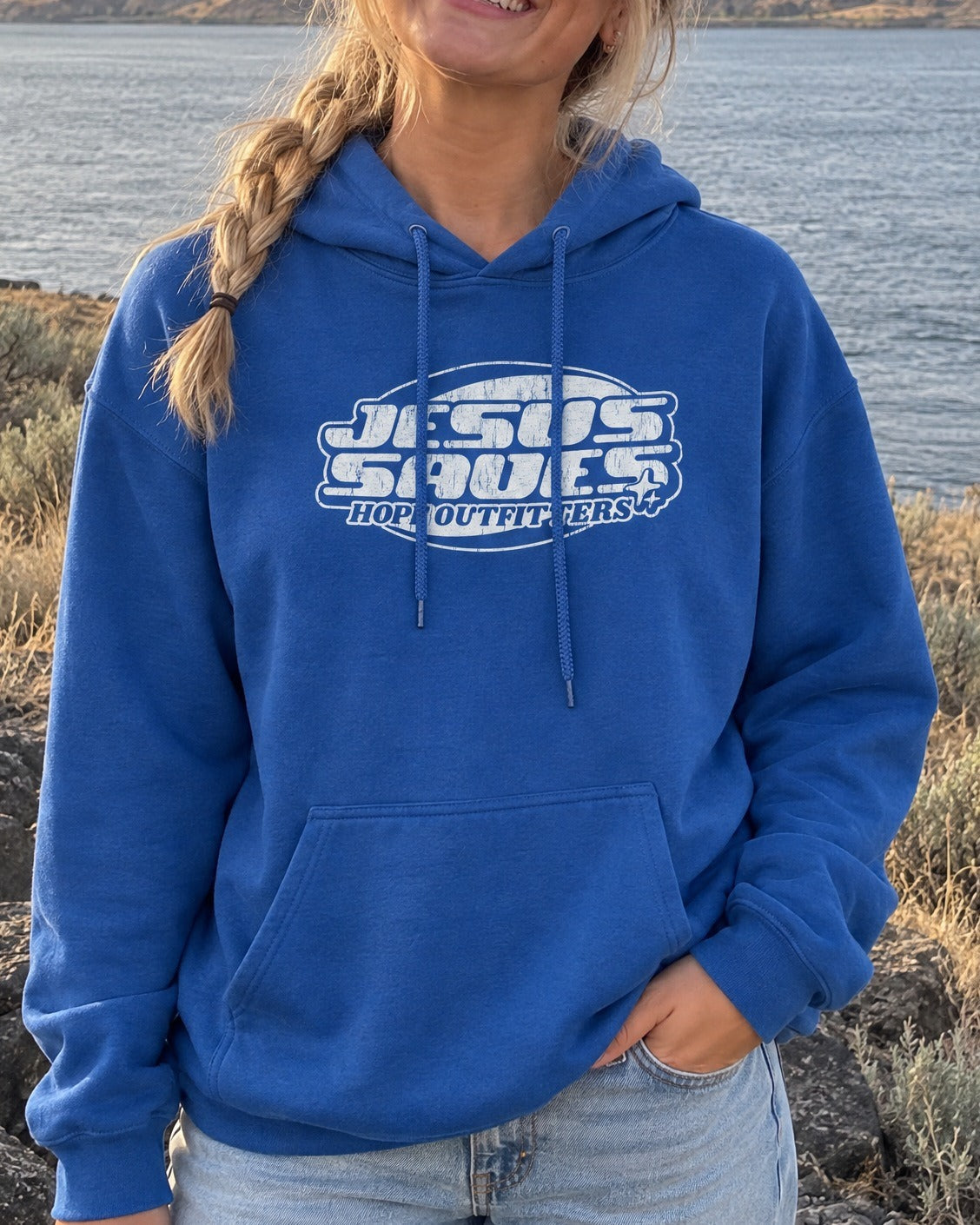 Jesus Saves Retro Hoodie - close-up of the Royal blue hoodie print worn by a blonde woman