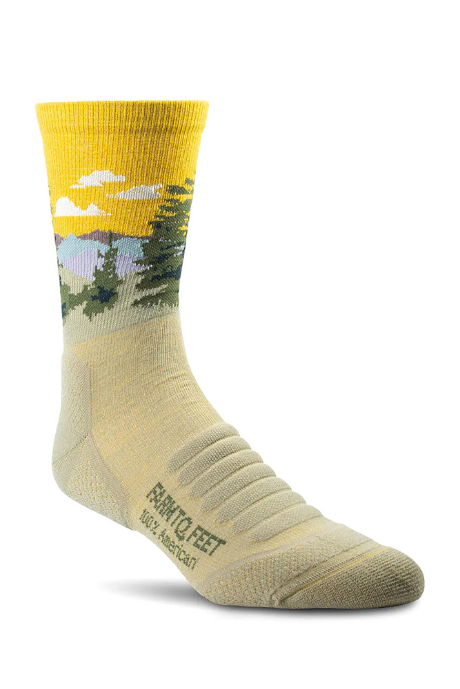 USA-made 3/4 Cascade socks in desert tan with a sunrise and pine tree design