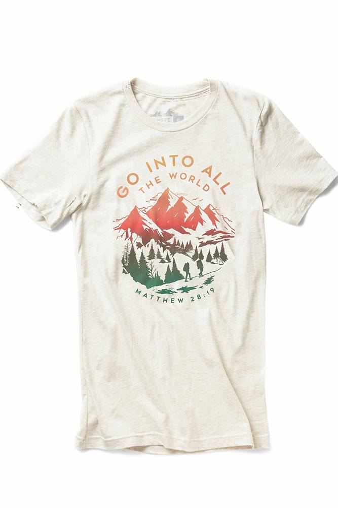 Go Into All The World Christian t-shirt, cream with mountain print, front flat lay